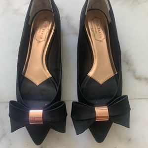 Ted Baker. Bow tie black flats with rose gold accents. Size 39- fits like an 8